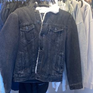 Black denim jacket with white fur inside